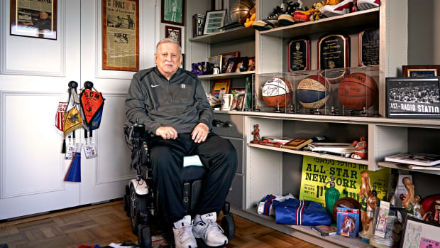 TEAM PLAYER Turetzky, who has been on the job courtside for 54 years, keeps a shrine to the Nets in his apartment.